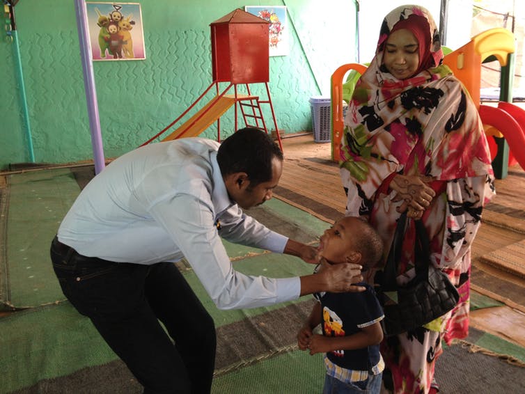 Fadil with paediatric dental patient
