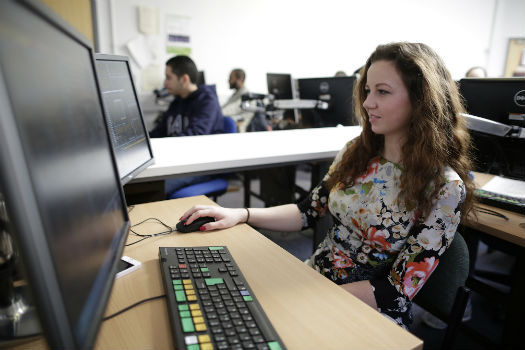 QMUL student working at a computer