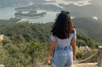 Tejal Shah at the top of a mountain looking over the Thousand Islands reservoir in Hong Kong