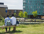 Students opposite canalside on our Mile End campus