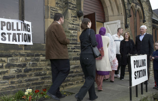People entering a polling station