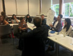 Photograph: Academics working during the interdisciplinary workshop at Queen Mary