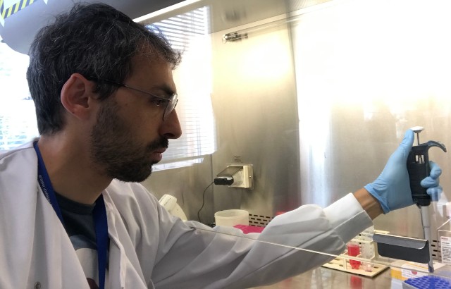Gianmichele Massimo working in his laboratory