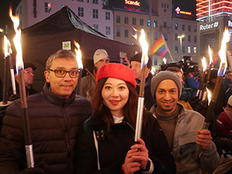 Professor David McCoy, Miranda Liang and Krishen Samuel at the torch procession in Oslo, Norway