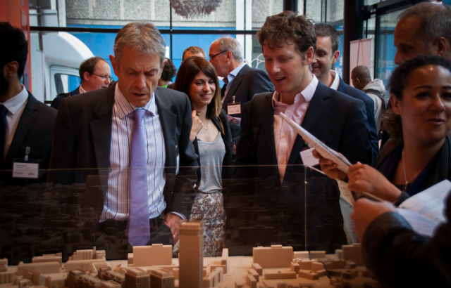 President and Principal Simon Gaskell looking over the model of Whitechapel development
