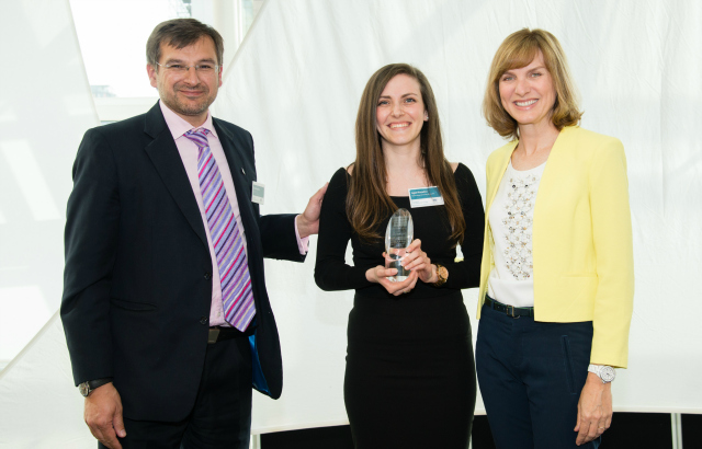 Aysel (centre) collecting her award from Fiona Bruce and David Bearfield, Director, European Personnel Selection Office, EU Careers