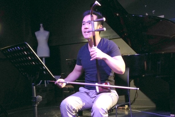 Researcher Luwei Yang playing the erhu