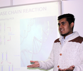 Fahim Ali, a Year 13 student taking part in the project, presents the group's work