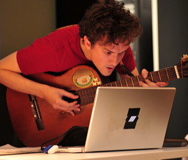 Dan Stowell tries out HOTTTABS at the Music Hack Day (Image courtesy of Thomas Bonte)