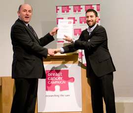 Claudio Raimondi receiving the award from Breast Cancer Campaign