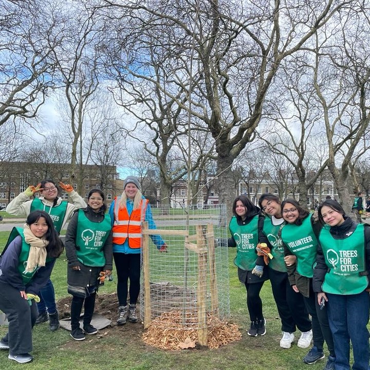 Students in Victoria Park after tree planting with Trees for Cities