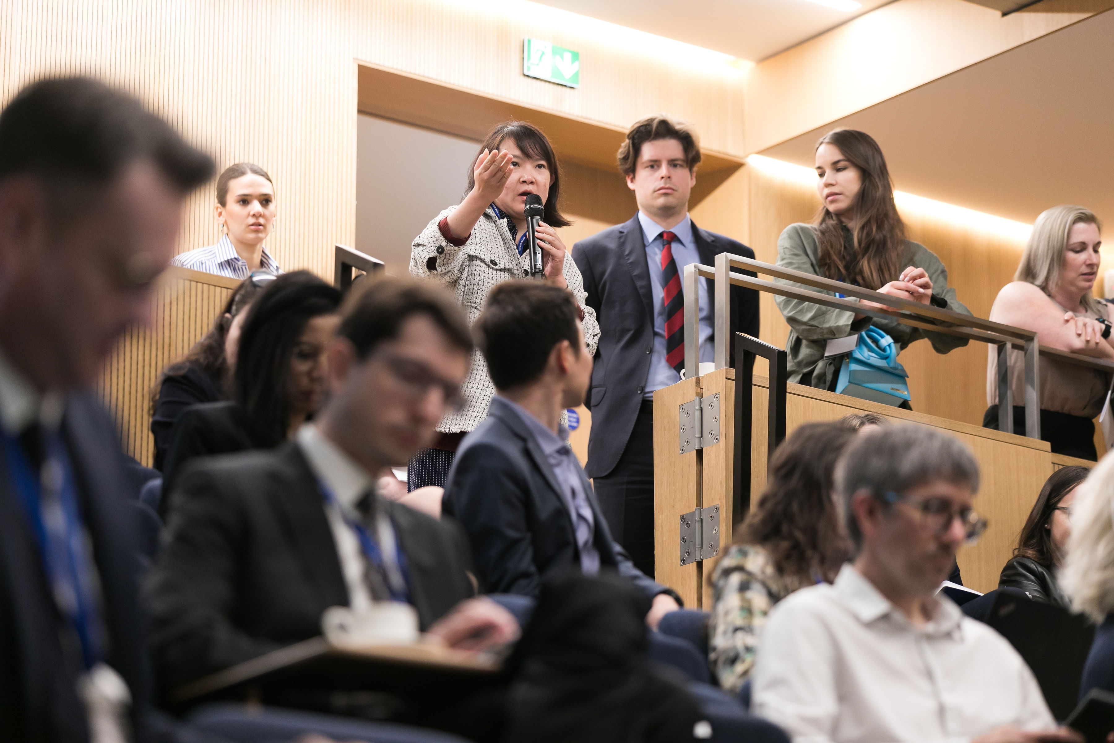 A participant asking question to the panel at QMIPRI Conference 2022