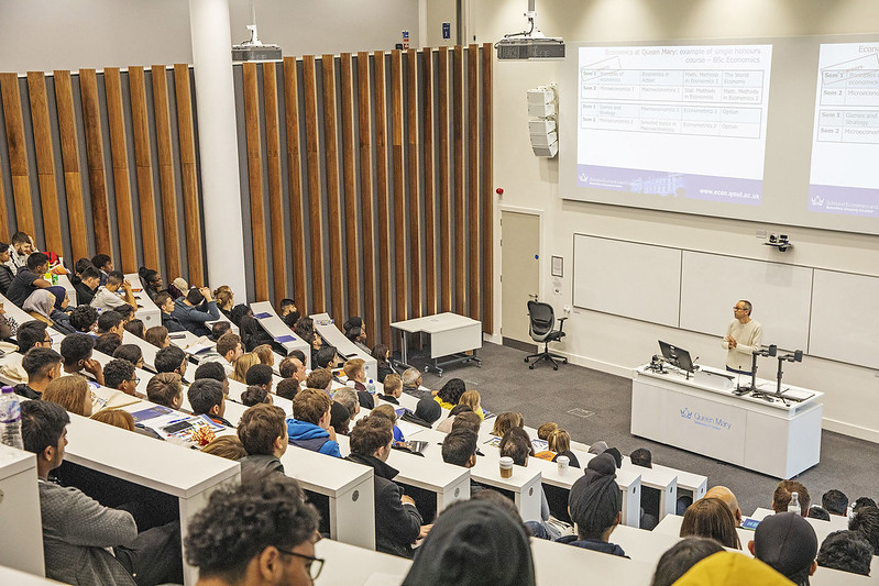 Students in a large lecture theatre