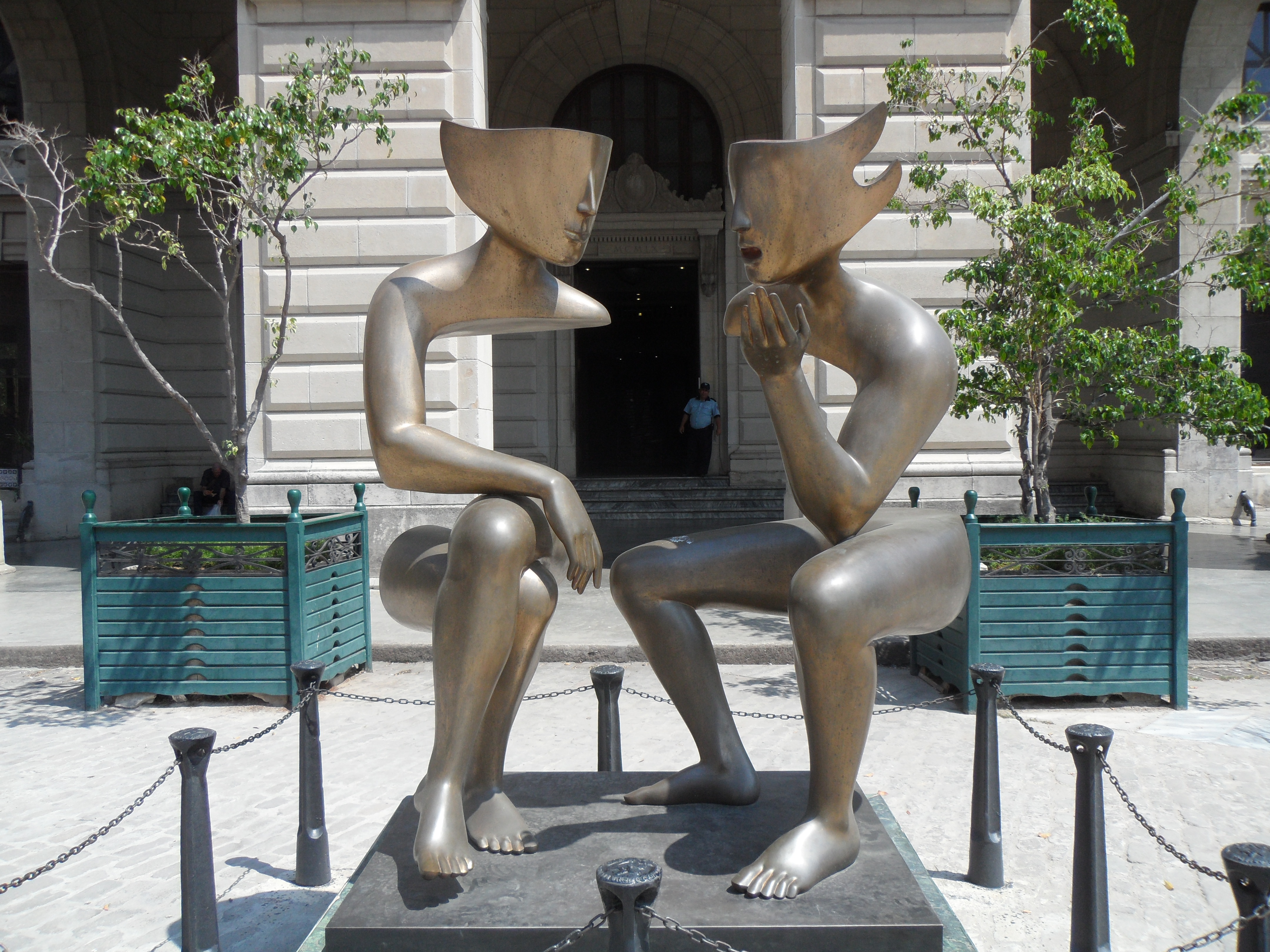 Abstract sculpture of two figures sitting
