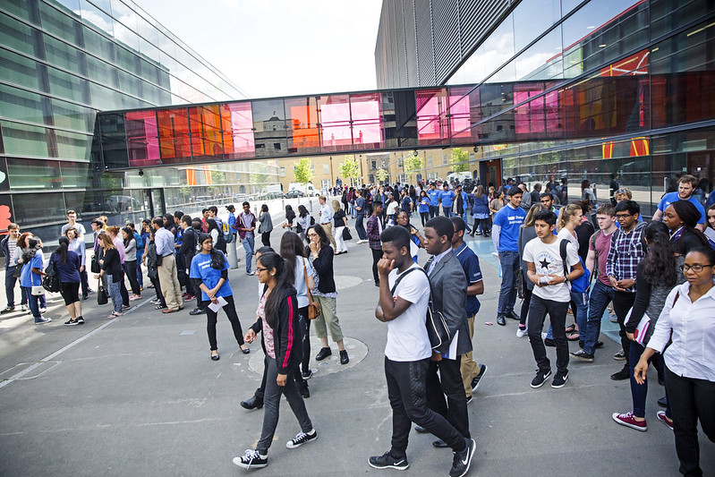 Students walking across campus buildings