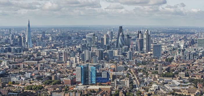 An aerial photograph above Whitechapel featuring The Royal London Hospital looking towards The City of London