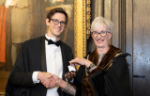 Paul Vulliamy receiving the Apothecaries' Prize from master of the society Professor Jane Anderson