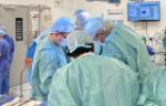 Surgeons operating in theatre