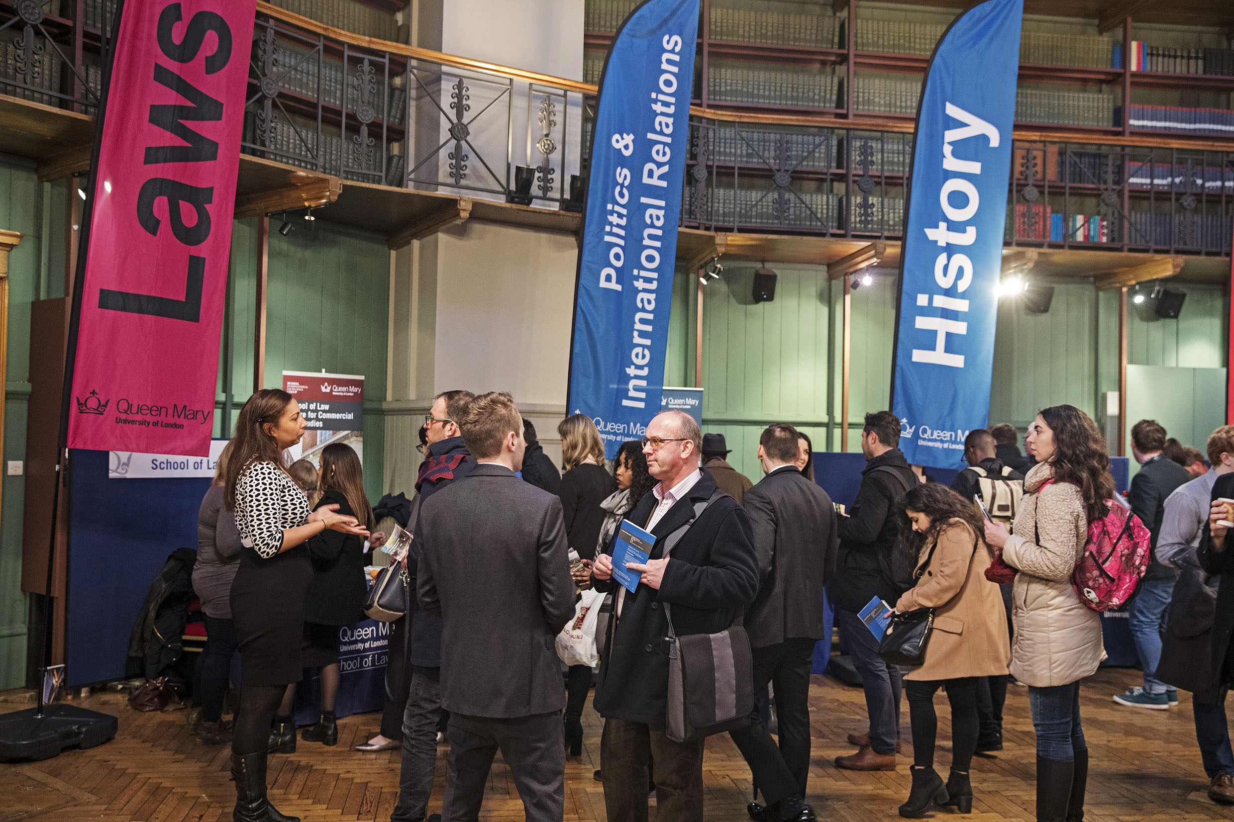 A group of people at a postgraduate study open evening
