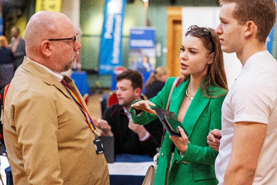 A group of people talking at an event