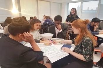 Students sat around table and working together