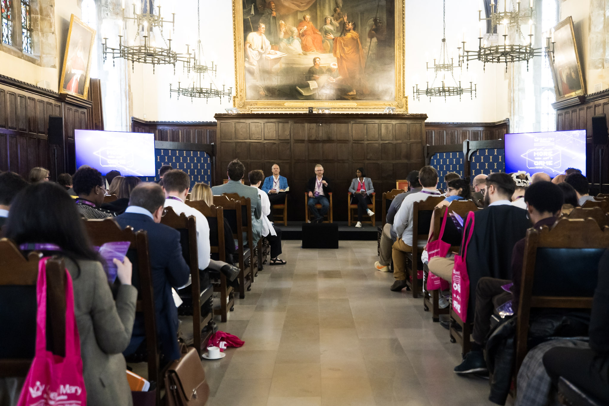 Photo of the Old Hall at Lincoln's Inn set up for More Than Just a Game 2024 with the audience in their seats and a panel sat at the front