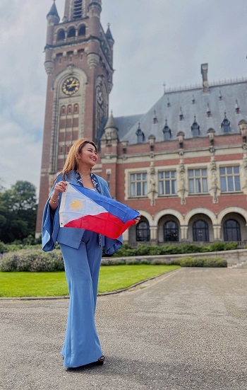 Khristine Jane Ejercito with a flag