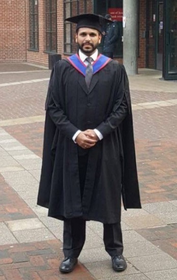 Abhishek Tilak wearing mortar board and gown at graduation