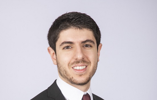 Man in suit smiling at camera