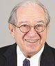 Prof Lew, older man with grey hair and small round glasses smiling