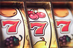 A slot machine showing three 7 symbols