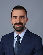 Filip Šaranović wearing a suit and tie.