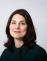 Profile image of academic Franziska Arnold-Dwyer. She has dark brown shoulder-length hair worn in a side parting and fair skin. 