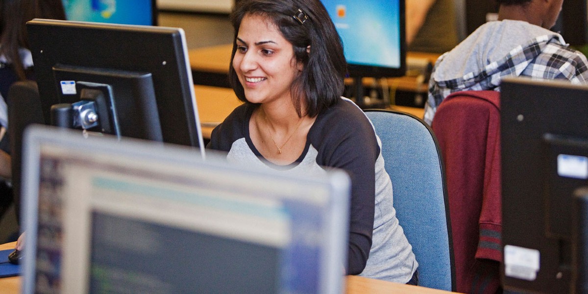 Students looking at computer