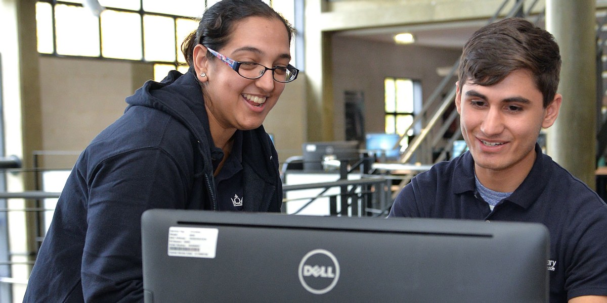 Students looking at computer