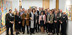 Various members of the Energy Law Institute gathered together in an art gallery