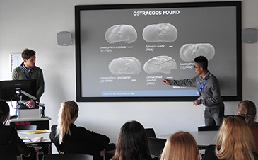 Geography student Koh Yi Thong (right) explains findings of the joint research project at the BCUR at Bournemouth University.