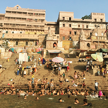 Locals, visitors and pilgrims bathe in the holy River Ganges at Dashashwamedh Ghat, Varanasi.