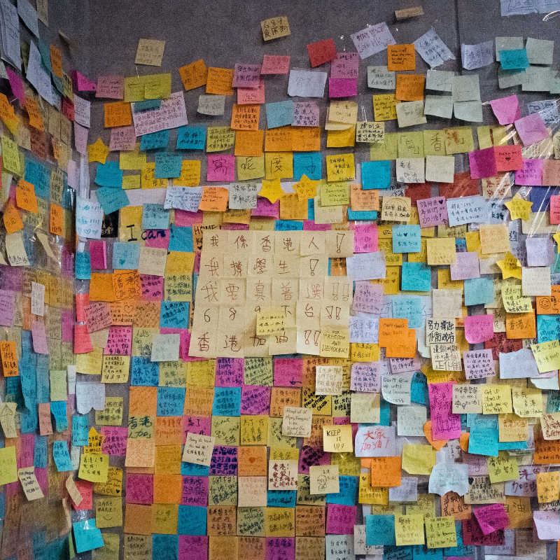Wall covered with Post-it notes of different colours