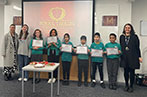 The winners of the regional final of the School Tasking at Queen Mary holding their certificates.