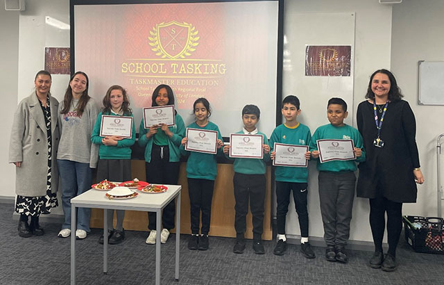 The winners of the regional final of the School Tasking at Queen Mary holding their certificates.