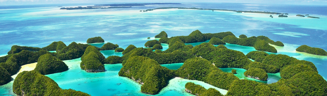 A group of tropical islands surrounded by clear blue ocean