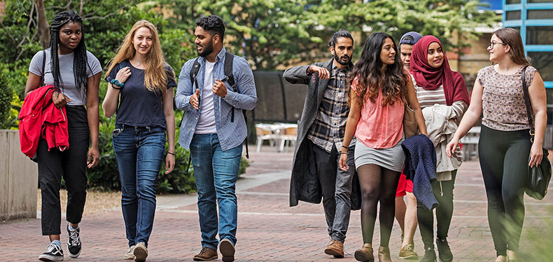 Students walking about QMUL campus