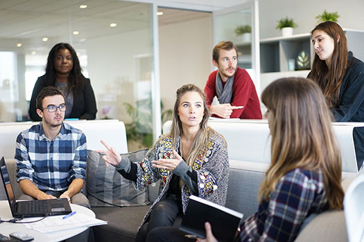 A group of office workers in a meeting