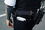 Gear and waist of a police officer at Notting Hill Carnival