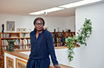 Professor Phoebe Okowa standing in a library