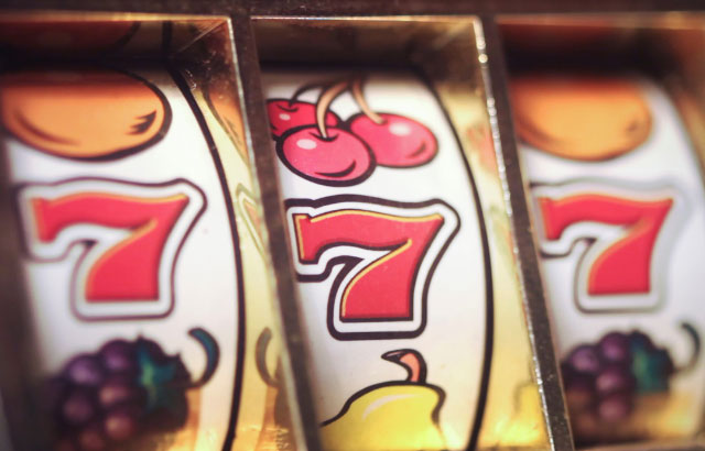 A slot machine showing three 7 symbols