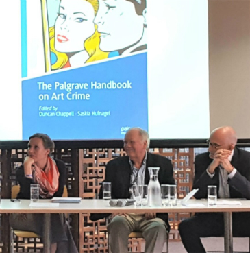 Saskia Huffnagel sat on the left of two other panelists at the Art Crime Book Launch