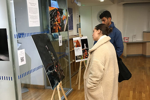 People viewing art at the ‘Re-imagining Justice’ exhibition