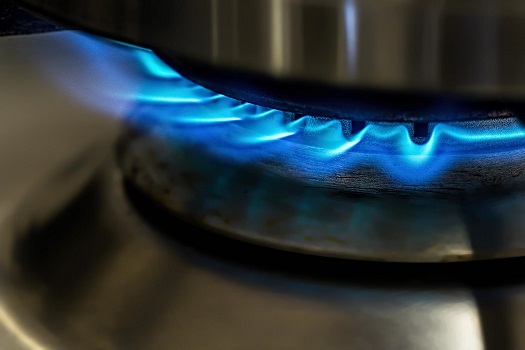 A flame burning on a gas hob